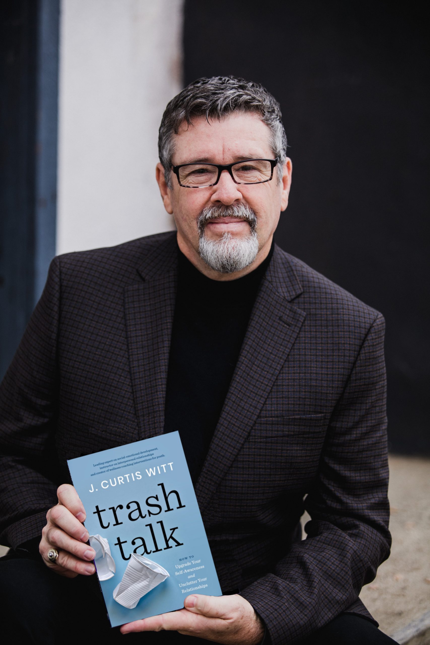 Photo of Jack holding trash talk book